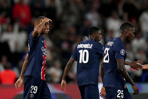 League 1, Paris Saint-Germain vs Montpellier: PSG's Bradley Barcola, left, reacts after scoring his side's third goal